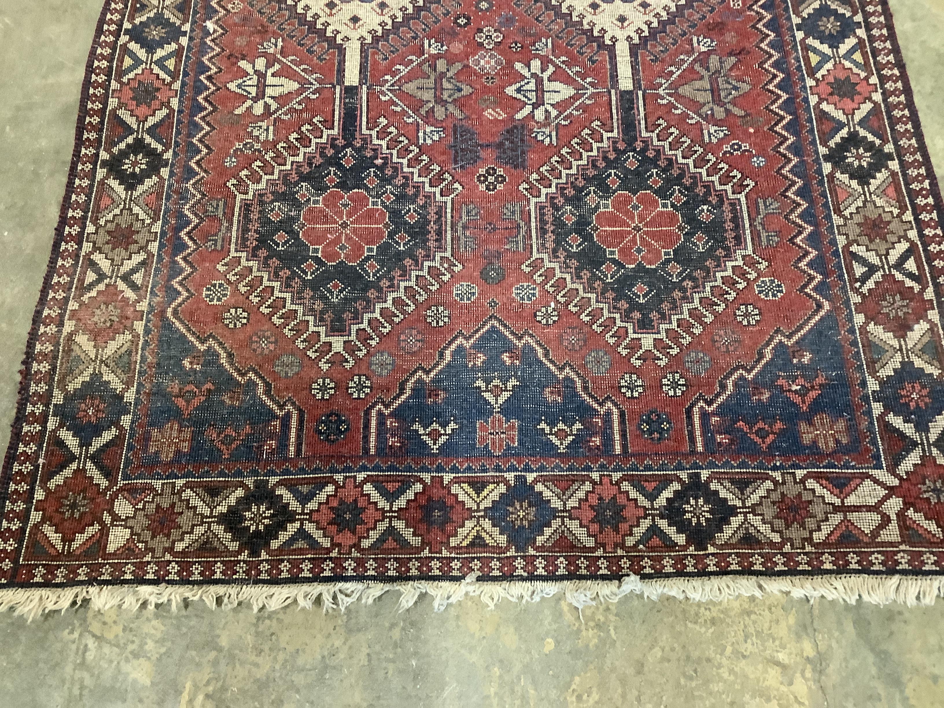 A Caucasian style red ground rug, 146 x 100cm